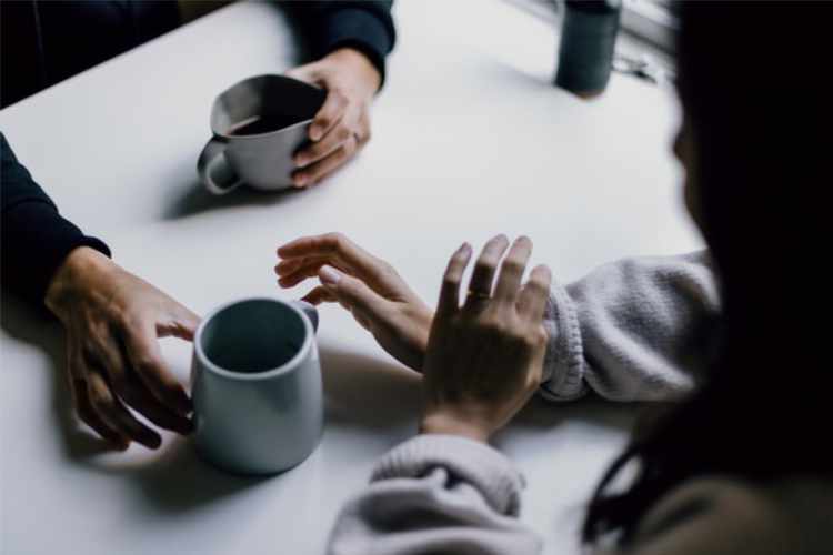 People chatting over a cup of coffee